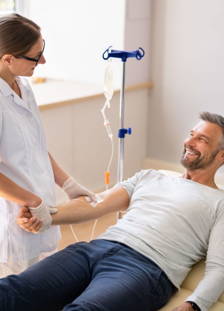 Nurse administering mobile vitamin IV drip therapy in London